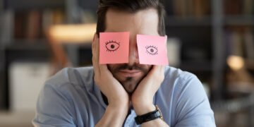 man falling asleep at work