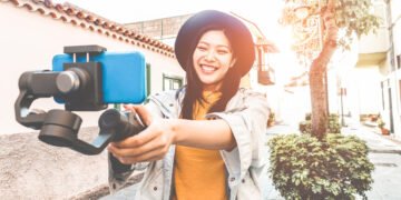 woman with camera videoing herself for youtube